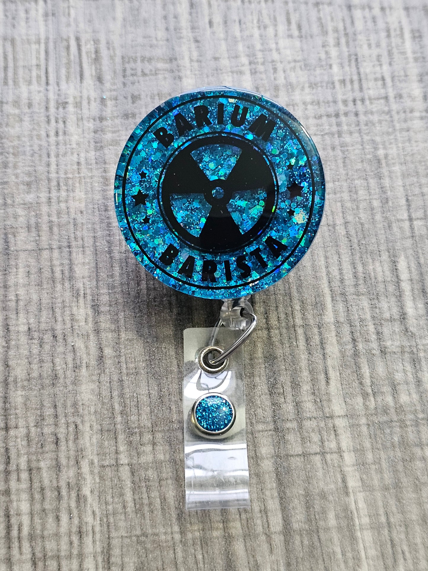 A Badge Reel with the words Barium Barista