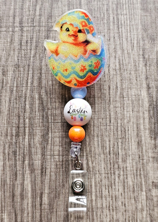 A Badge reel featuring an easter duckling hatching out of an easter egg.