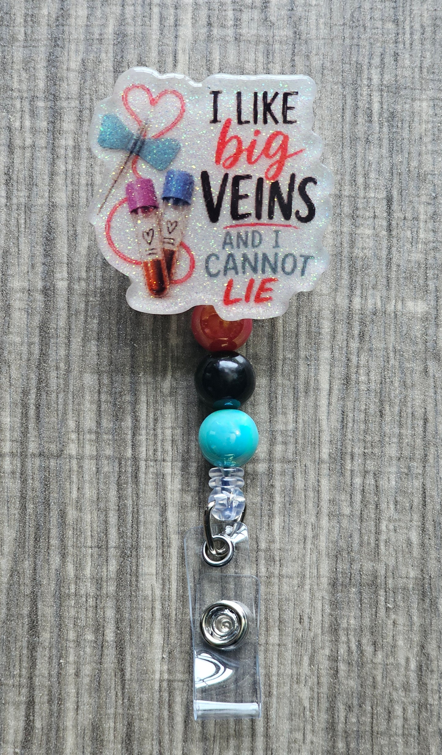 Cartoon graphic of blood collection tubes with the text "I LIKE BIG VEINS AND I CANNOT LIE".