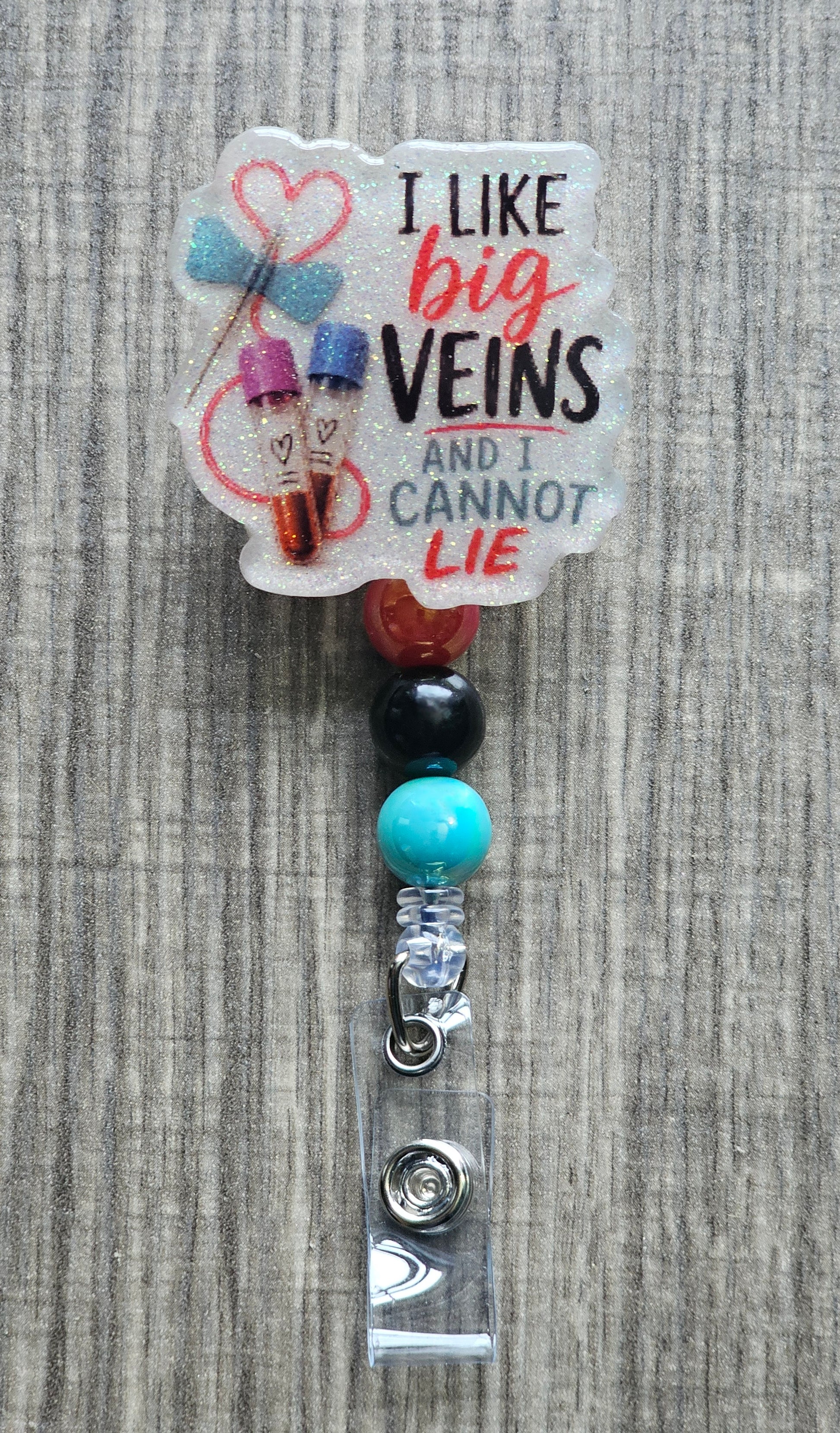 Cartoon graphic of blood collection tubes with the text "I LIKE BIG VEINS AND I CANNOT LIE".