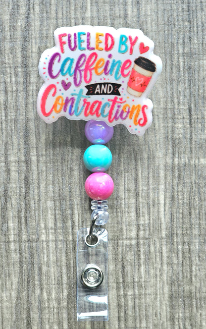 Colorful hand-lettered text reading "Fueled by Caffeine and Contractions" next to a pink coffee cup.