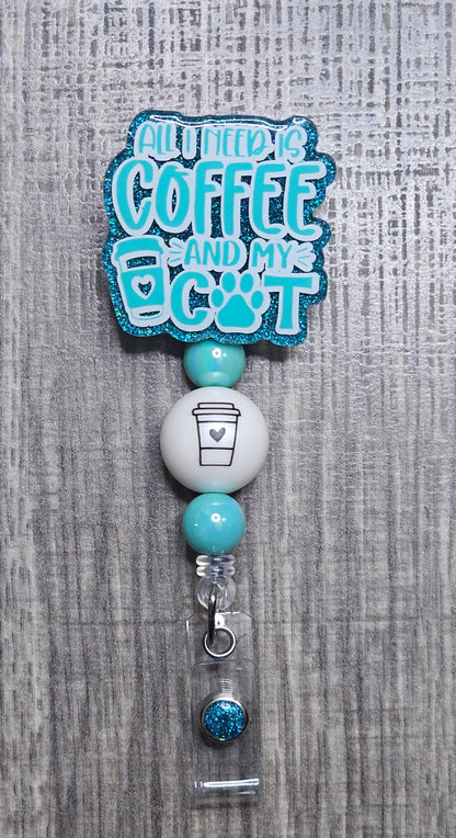 Badge holder with 'All I Need is Coffee and My Cat' text on a textured gray background
