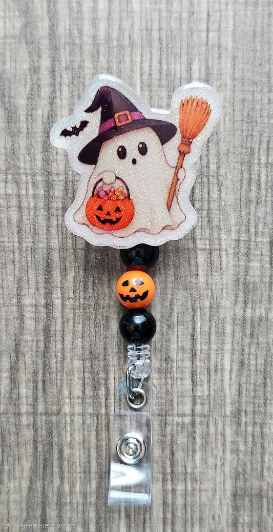 Adorable Halloween badge reel of a baby ghost wearing a witch hat and holding a broom stick with colorful coordinating beads.