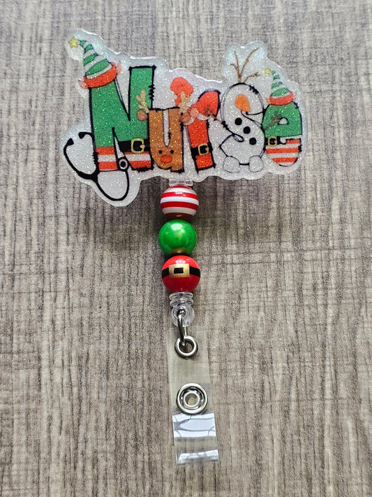 A Badge Reel with each letter of the word "NURSE" is creatively designed to spread holiday cheer: the "N" is dressed as an elf with a stethoscope, the "U" as a playful reindeer, the "R" as Santa Claus, the "S" as a jolly snowman, and the "E" as another cheerful elf.