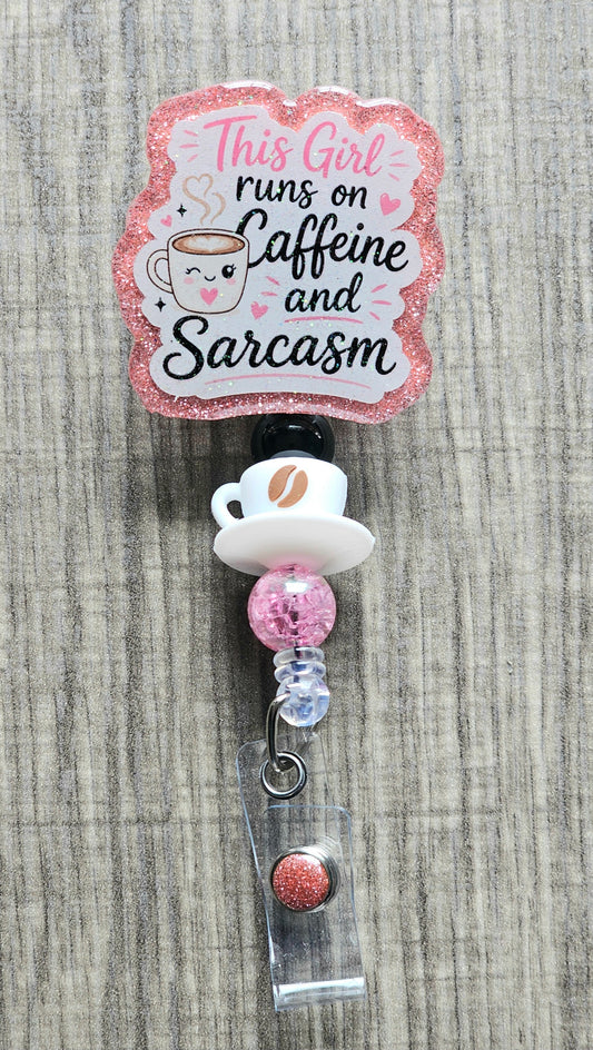 A cute smiling coffee cup surrounded by pink hearts and the text "This Girl runs on Caffeine and Sarcasm".