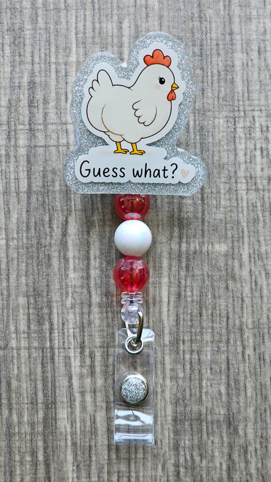 Cute white cartoon chicken looking over its shoulder with the text "Guess what?" written below, perfect for a funny badge reel.