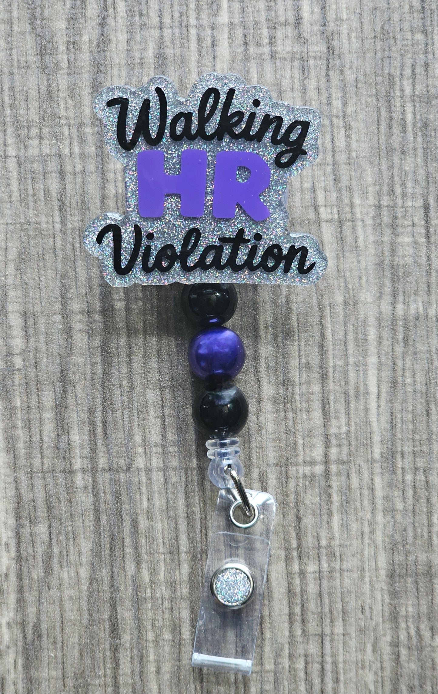 Bold, stylized text in black and purple reading "Walking HR Violation" on a white background.