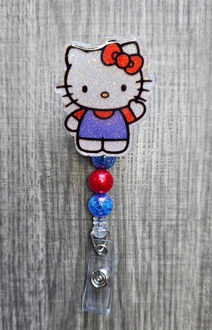 Hello Kitty badge holder with colorful beads on a gray background
