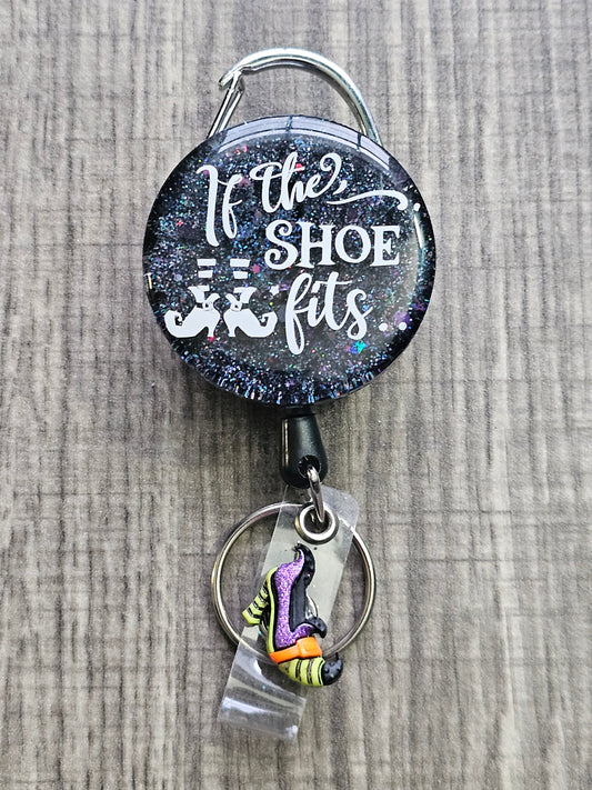  A Halloween Badge Reel with a starry background and the words If The Shoe Fits 