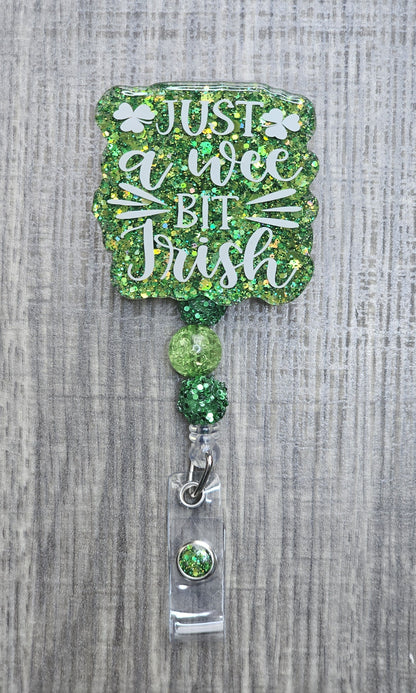 Beaded badge reel for St. Patrick's Day with "Just a Wee Bit Irish" text and matching green and white decorative beads.