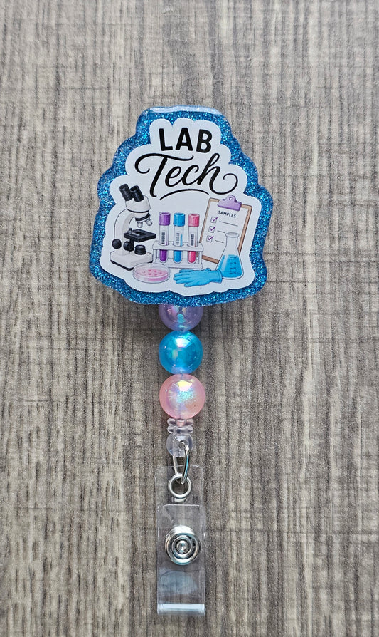 Lab tech badge reel featuring a microscope, vials, platelet sampler, checklist, and medical glove icons with matching beads.