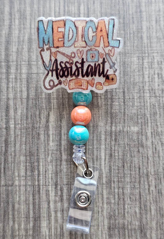 Badge holder with 'Medical Assistant' text and colorful beads on a textured background