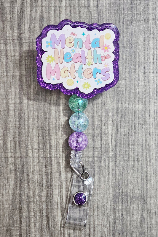 Badge holder with 'Mental Health Matters' text on a textured gray background