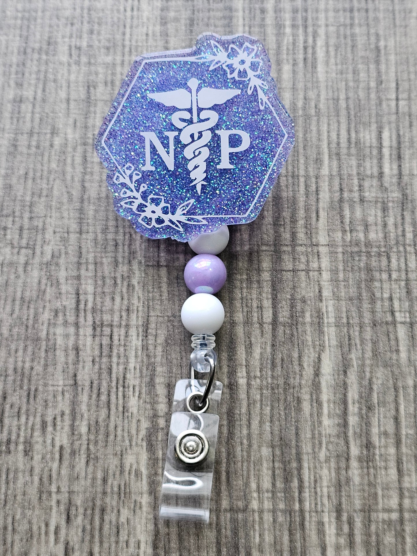  A Badge Reel with the letters NP to represent Nurse Practitioners