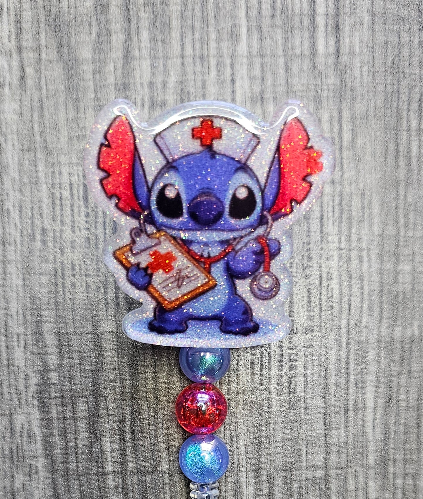 Character resembling Stitch from Lilo & Stitch wearing a nurse's outfit with colorful beads on a textured gray background.