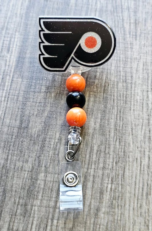 Philadelphia hockey badge reel shaped like classic logo, available in acrylic glitter.