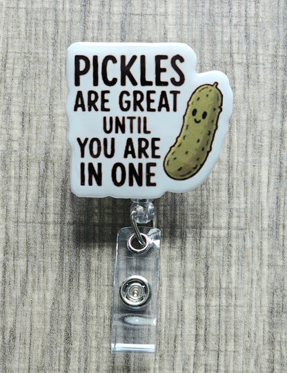 Cute cartoon pickle smiling with the text "Pickles are great until you are in one", perfect for a retractable badge clip.
