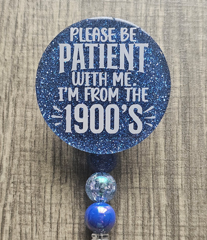 a badge reel stating please be patient with me I'm from the 1900'S which can be available in a variety of colors.