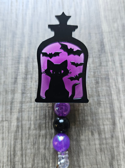 Glow-in-the-Dark Lantern Cat Badge Reel - Purple Eerie Charm