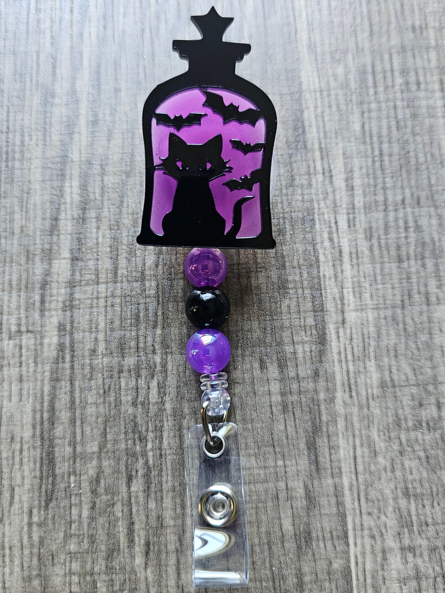 Glow-in-the-Dark Lantern Cat Badge Reel - Purple Eerie Charm