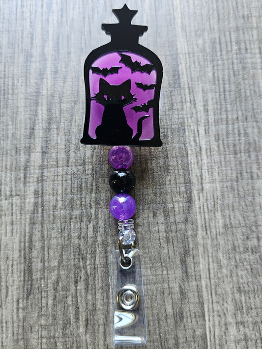 Glow-in-the-Dark Lantern Cat Badge Reel - Purple Eerie Charm