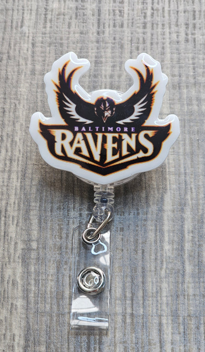 NFL Baltimore Ravens helmet with team logo and "Baltimore Ravens" text on a retractable badge reel.