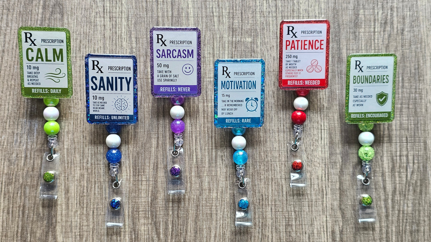 Faux medical prescription labels for Sanity, Motivation, Calm, and Patience on retractable work badge reels.