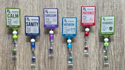 Faux medical prescription labels for Sanity, Motivation, Calm, and Patience on retractable work badge reels.