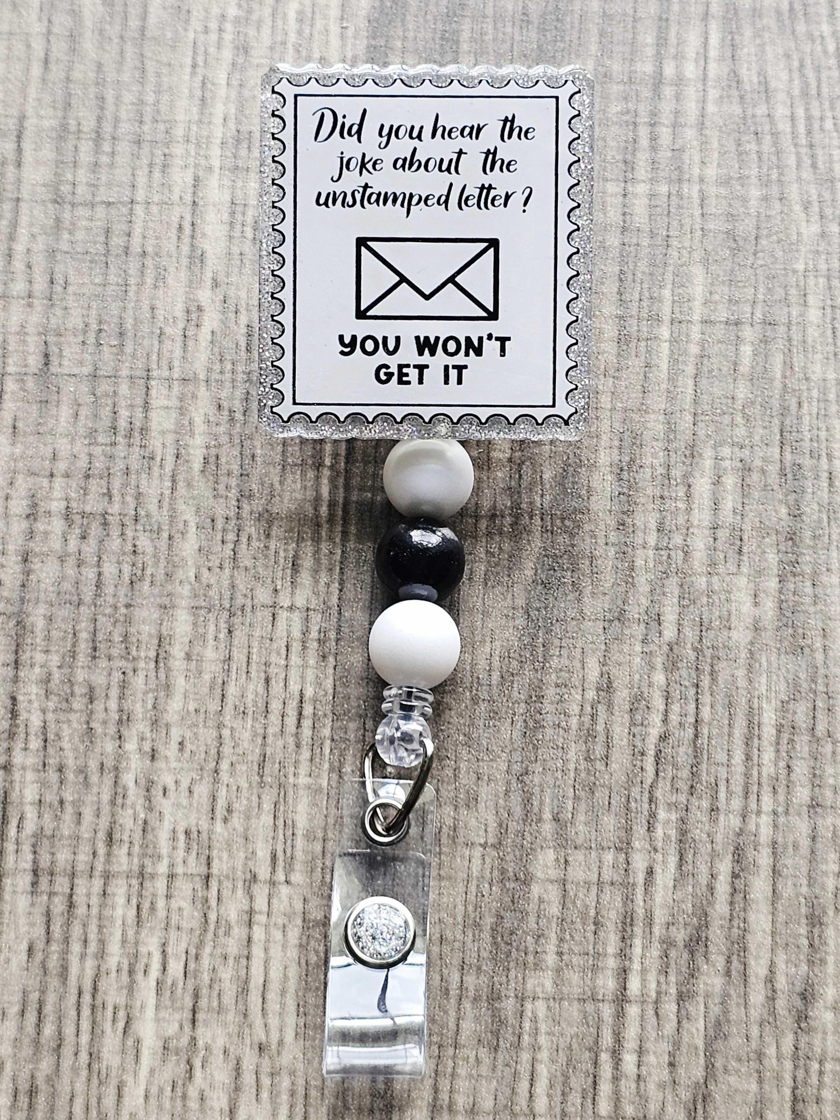 Unstamped Letter Joke Postal Stamp Badge Reel – A Reel Badge Girl