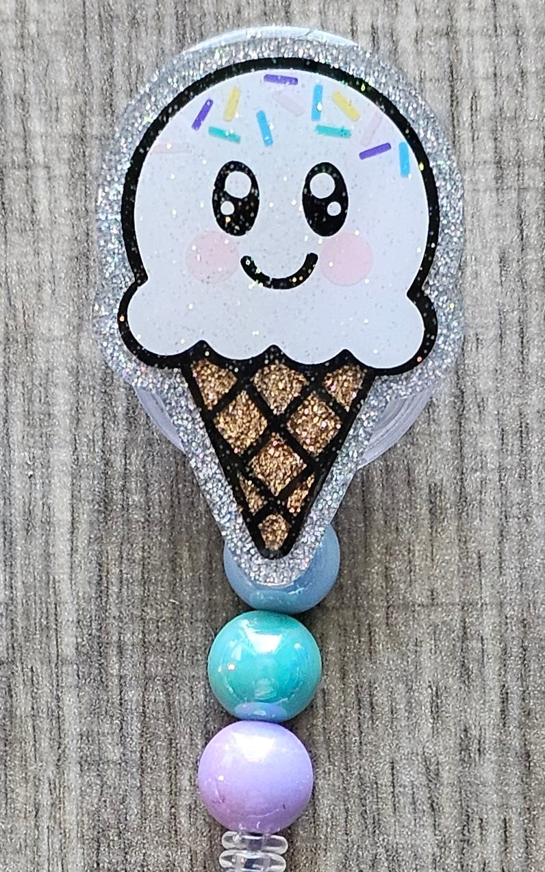 Vanilla Ice cream cone-shaped badge reel with beads attached.