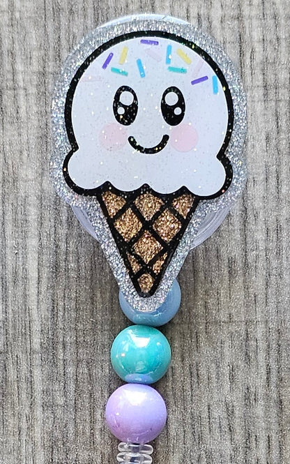 Vanilla Ice cream cone-shaped badge reel with beads attached.