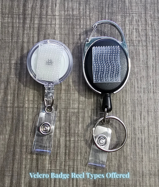 Two Velcro badge reels on a wooden surface with text indicating types offered.