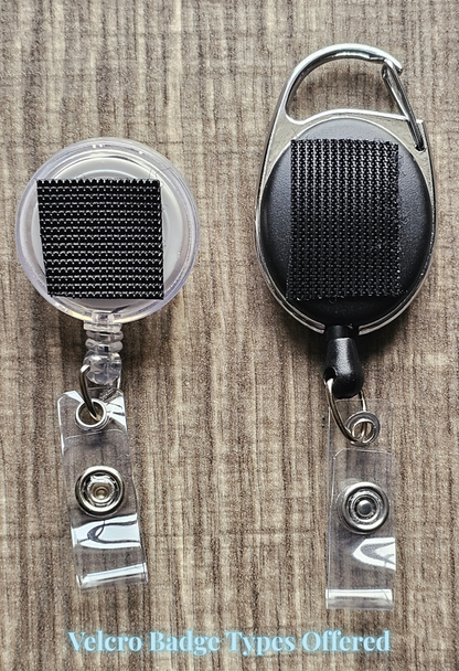 Two badge holders with black velcro on a wooden surface, labeled 'Velcro Badge Types Offered'.