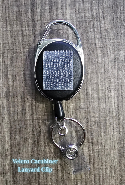 Retractable badge reels with strong Velcro attachments, featuring a durable carabiner style. Perfect for secure and convenient ID badge or key storage.
