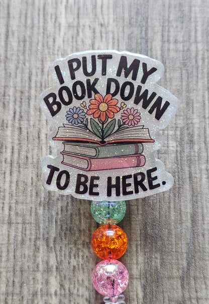 I Put My Book Down To Be Here Badge Reel - Funny Reader & Librarian Gift