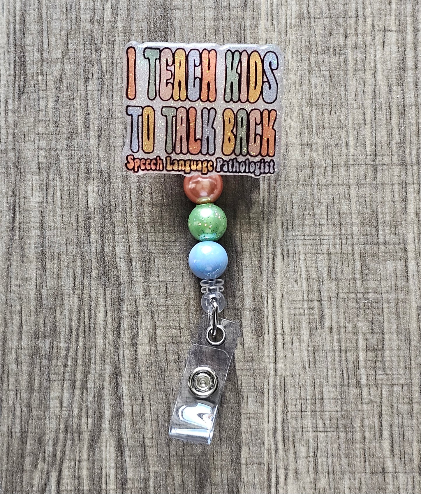 "I Teach Kids to Talk Back, Speech Language Pathologist" badge reel.