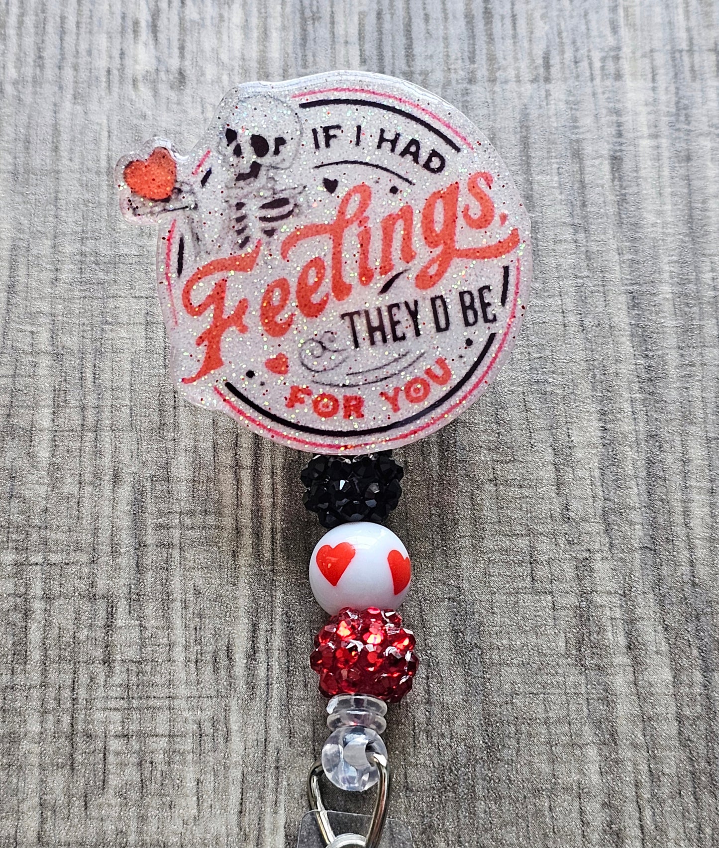 A badge reel featuring a skeleton holding a heart with the words If I had feelings they'd be for you  