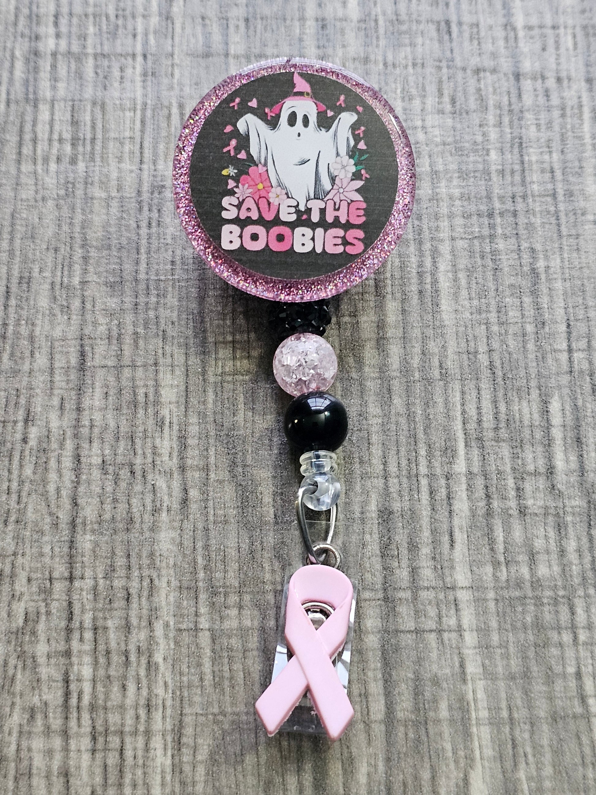  A Halloween themed Badge Reel with the statement Save The Boobies decorated in a Halloween theme and Breast Cancer awareness theme 